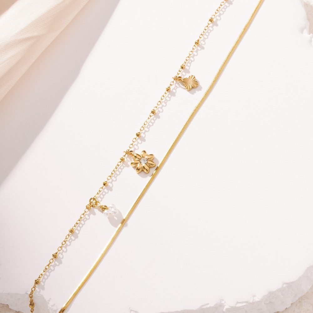 Bracelet doré double chaîne bi-maille fleurs et perles