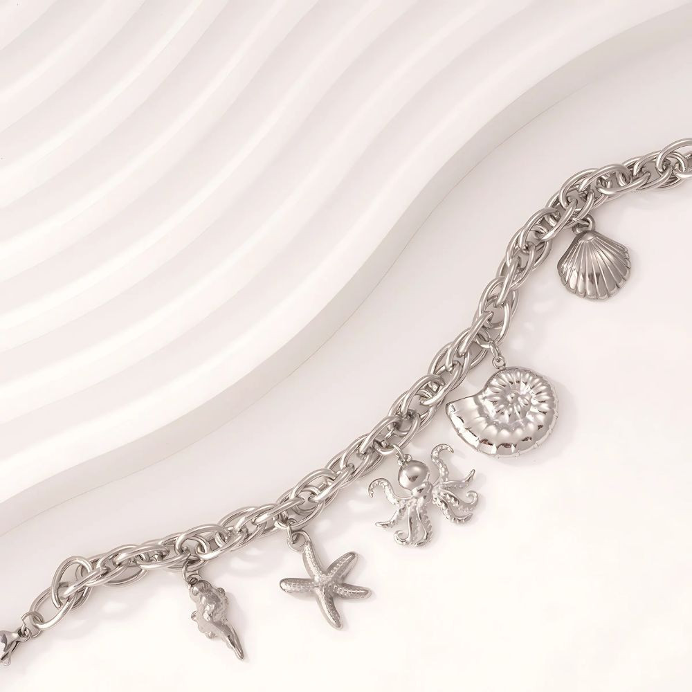 Bracelet argenté avec charms marins